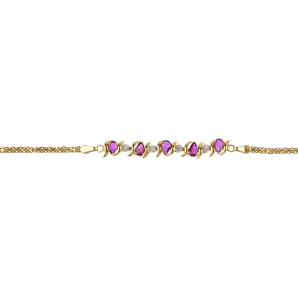 A ruby and diamond ring and bracelet.: A ruby and diamond ring and bracelet. The ring designed as a single-cu diamond line, within a circular-shape ruby surround, the bracelet designed as a series of five pear-shape rubies between diamond 
