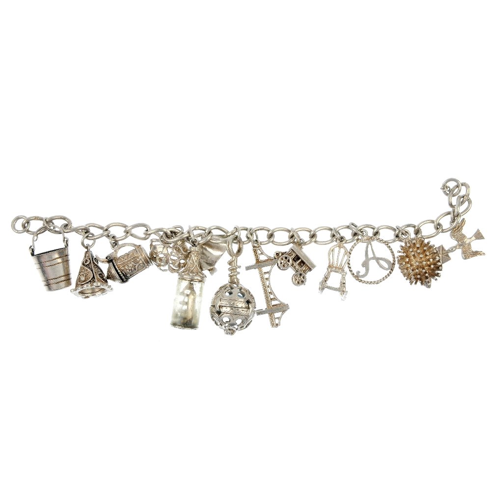 Two charm bracelets.: Two charm bracelets, the curb-link bracelets suspending a total of forty-two charms, one with a heart padlock clasp. One clasp deficient. Most with marks to indicate silver. Lengths 17cms. Weight 127.