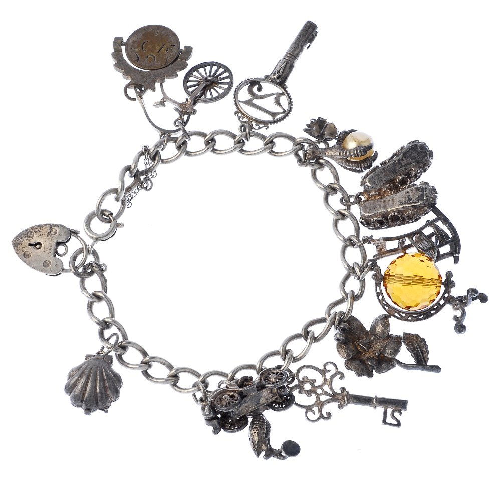 A selection of three charm bracelets.: A selection of three charm bracelets, the curb and belcher-link bracelets, suspending thirty-one charms, to include a bell, a church and an elephant. Some with marks to indicate silver 144.4gms.