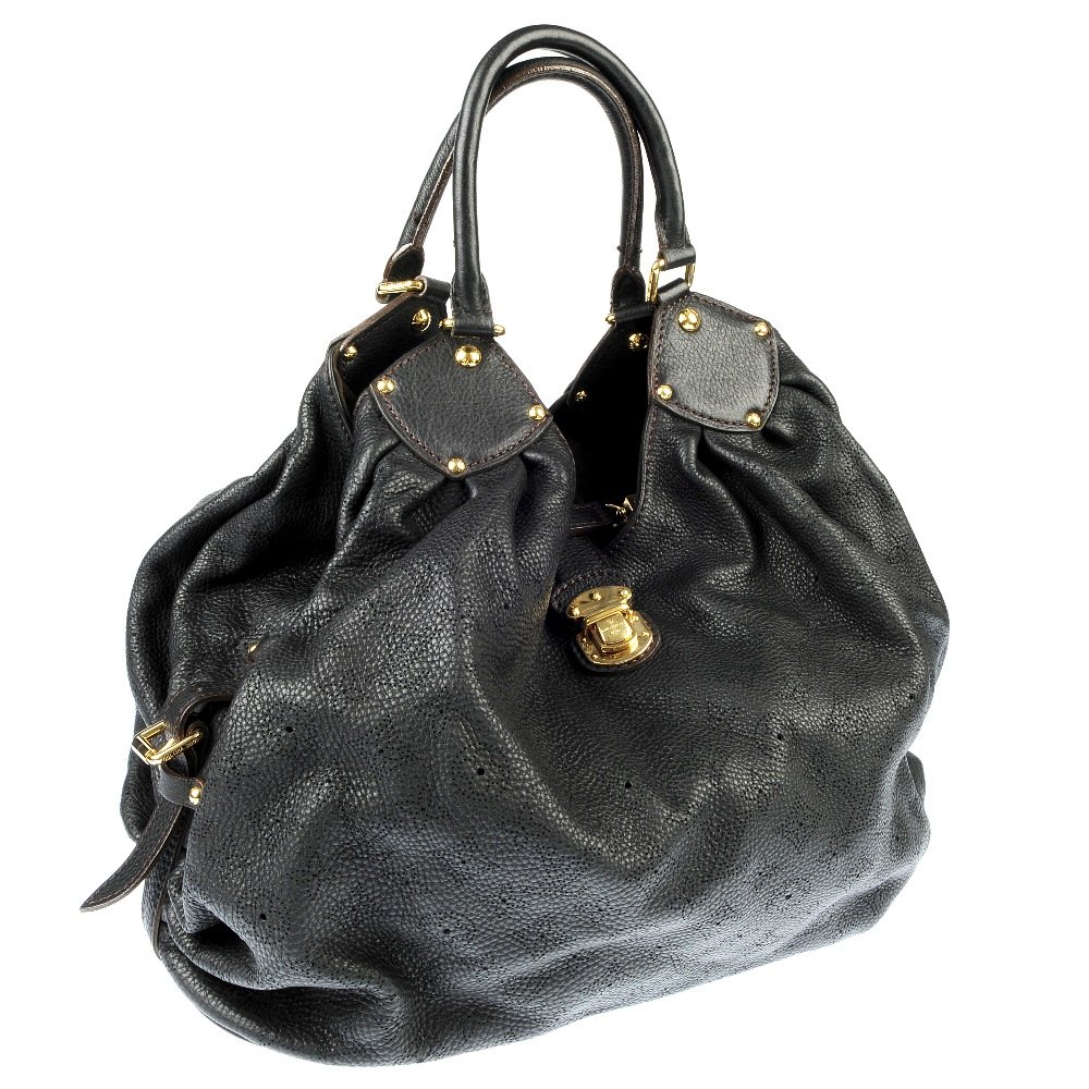LOUIS VUITTON - a black Neo L monogram Mahina leather: LOUIS VUITTON - a black Neo L perforated monogram mahina leather bag, with an open top secured by a flap and push lock closure, gold-tone hardware, side buckles, double rolled leather handles, microfi