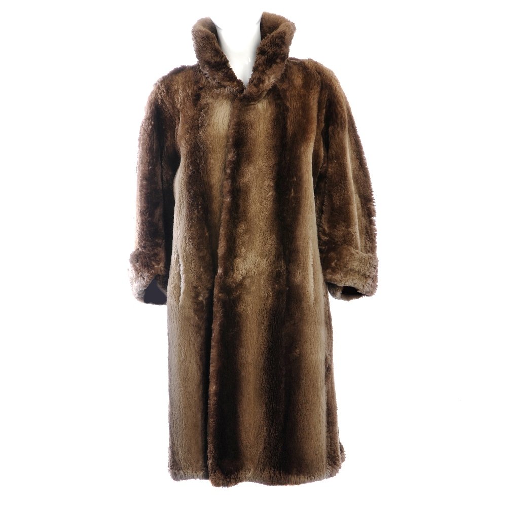 Phantom beaver coat: A full-length phantom beaver coat with wide three-quarter length cropped sleeves, a collar designed to be attached at either end, no front fastenings, double vents, two outer pockets, one inner patch 
