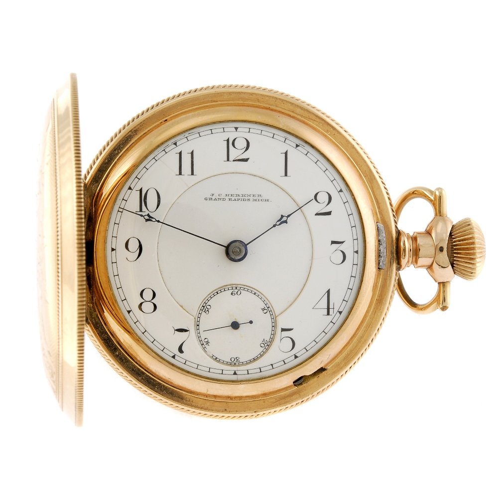 A rolled gold full hunter pocket watch by J. C.: A full hunter pocket watch by J. C. Herkner. Signed full plate keyless wind movement. White enamel dial with Arabic numeral hour markers, subsidiary seconds dial to six. Rolled gold case. 57mm.