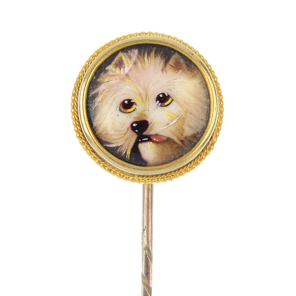 A late 19th century gold enamel stickpin.: A late 19th century gold enamel stickpin. The circular enamel disc, depicting a dog, within a collet mount and bead surround, to the spiral pin. Enamelled to reverse 'After Landseer. Marshall.' Diamet