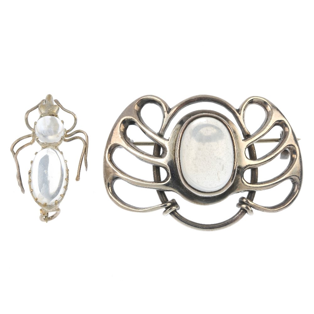 Two moonstone brooches.: Two moonstone brooches. To include an oval moonstone cabochon openwork brooch, together with a moonstone insect brooch. Lengths 4 and 2.3cms. Weight 10.9gms.