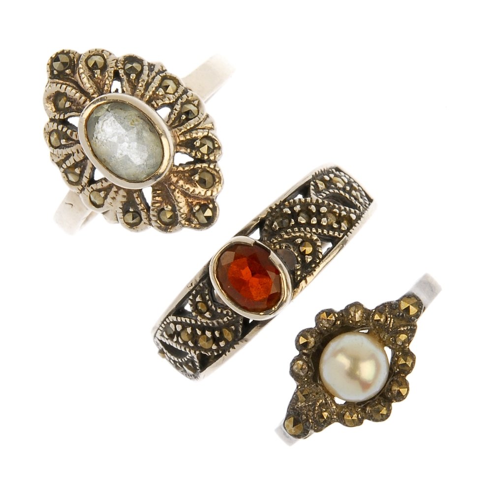 A selection of eighteen marcasite rings.: A selection of eighteen marcasite rings. To include two amethyst and marcasite rings, a blue topaz and marcasite ring and a garnet and marcasite ring with further marcasite and gem-set rings. Some mar
