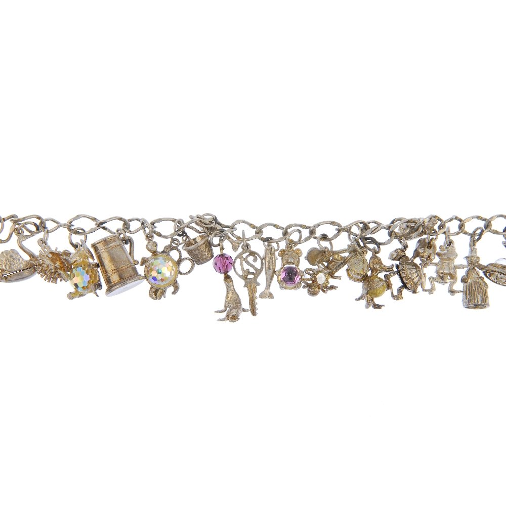 Three charm bracelets.: Three charm bracelets. The curb-link bracelets suspending a total of fifty-eight charms, to include enamel tourist shield charms, a tortoise and a tankard, two with heart padlock clasps and one with a