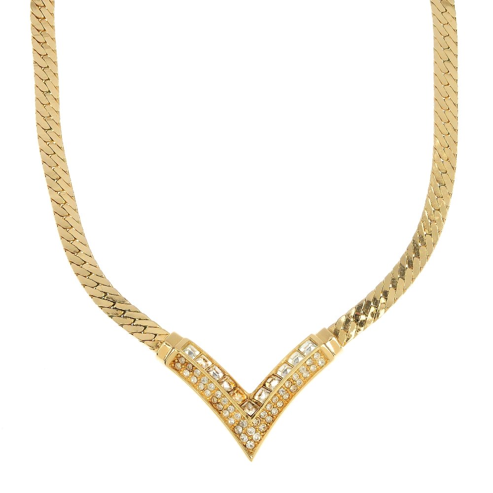 CHRISTIAN DIOR - a necklace. With maker's case.: CHRISTIAN DIOR - a necklace, featuring two chevrons set with a series of square and circular-shape colourless paste. Signed Chr.Dior. Length 39 to 46cms. With maker's case.