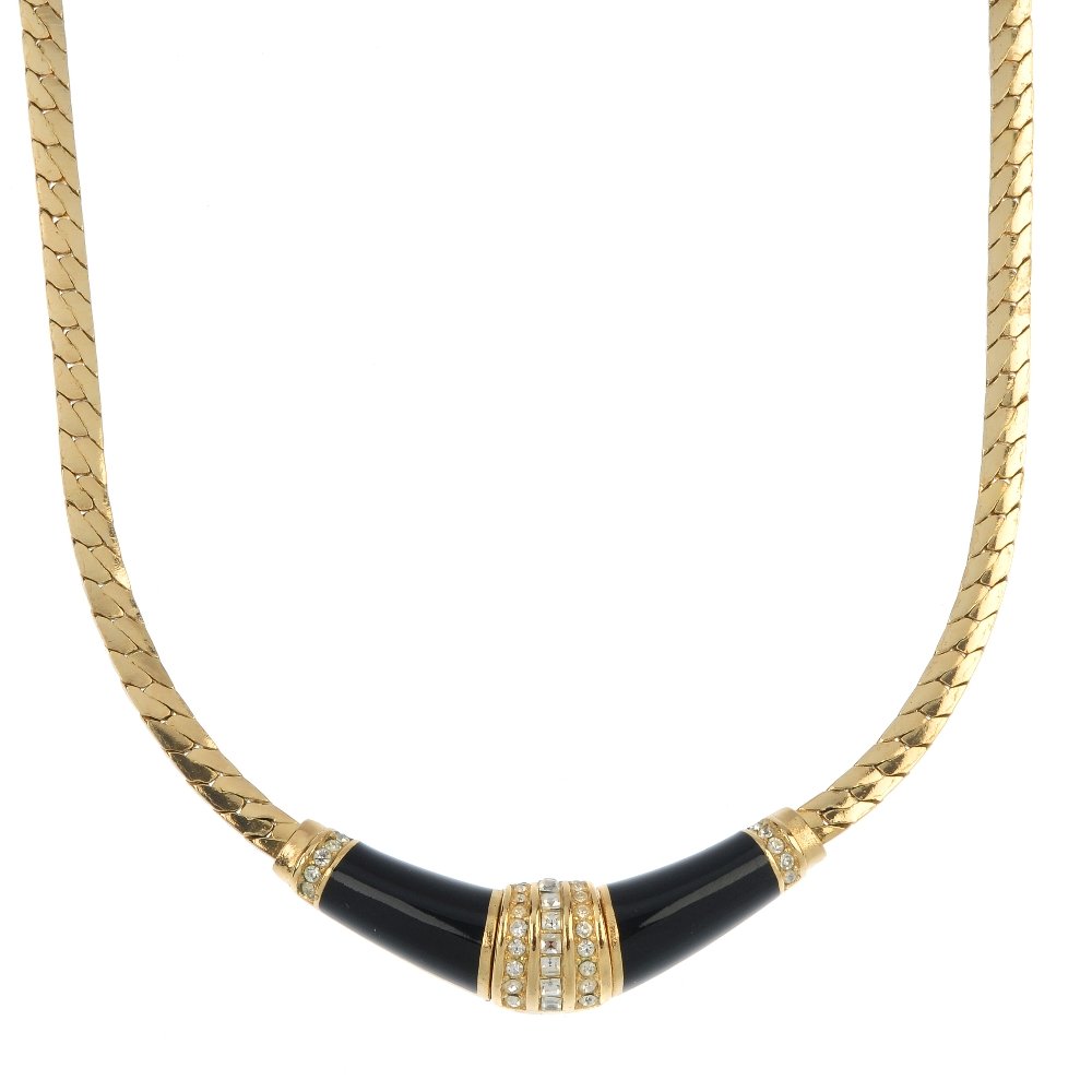 CHRISTIAN DIOR - a necklace and ear studs.: CHRISTIAN DIOR - a necklace and ear studs. The necklace designed as a central V-shape panel set with square and circular-shape colourless paste, bordered by black enamel and further colourless paste,