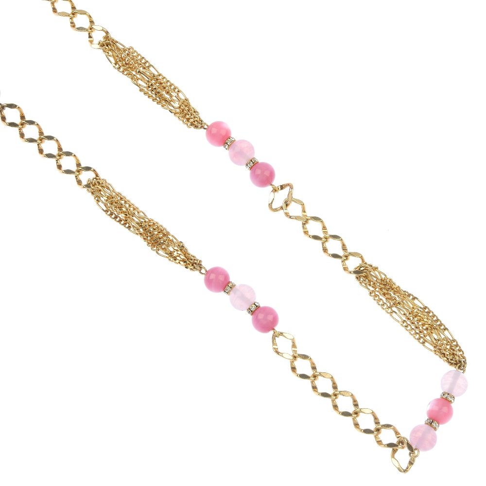CHRISTIAN DIOR - a necklace.: CHRISTIAN DIOR - a necklace. Designed as four panels of pink glass beads, with colourless paste separators, to the alternating three strand fancy-link chain and curb-link back chain. Signed Chr. Dior.