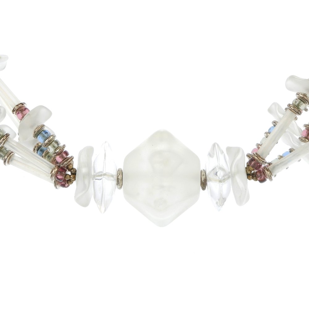 MIRIAM HASKELL - a necklace.: MIRIAM HASKELL - a necklace. Designed with a central frosted plastic panel, to the four strand tubular and abstract disc necklace with coloured glass bead detail. Signed Miriam Haskell. Length 46cm.