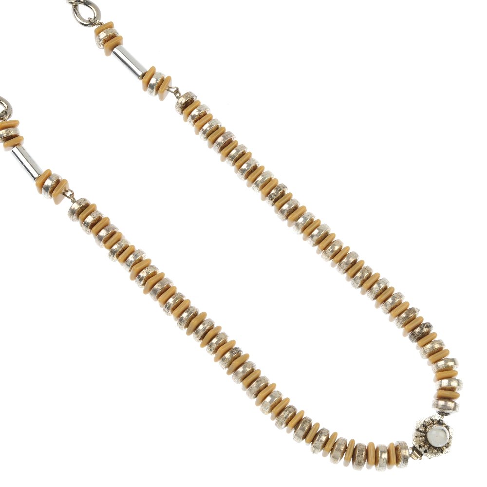 MIRIAM HASKELL - a necklace and a bangle set.: MIRIAM HASKELL - a necklace and a bangle set. To include a white metal and brown plastic alternating bead necklace, interspaced with tube bead spacers and figure of eight loop beads, to the decorative
