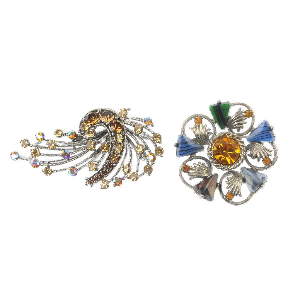 A selection of designer costume jewellery.: A selection of designer costume jewellery. To include a Christian Dior blue glass and colourless paste pendant on chain, and an openwork flower brooch by Sarah Lin, together with fourteen further broo