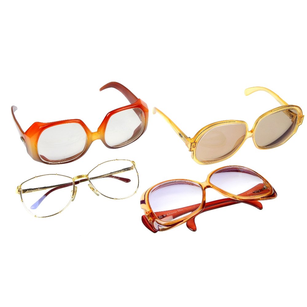 Four pairs of Christian Dior glasses and two opera: Four pairs of prescription glasses by Christian Dior. Three of a similar design with large circular lenses and hexagonal frames and a pair of gentlemen's glasses with thin metal frames, together with