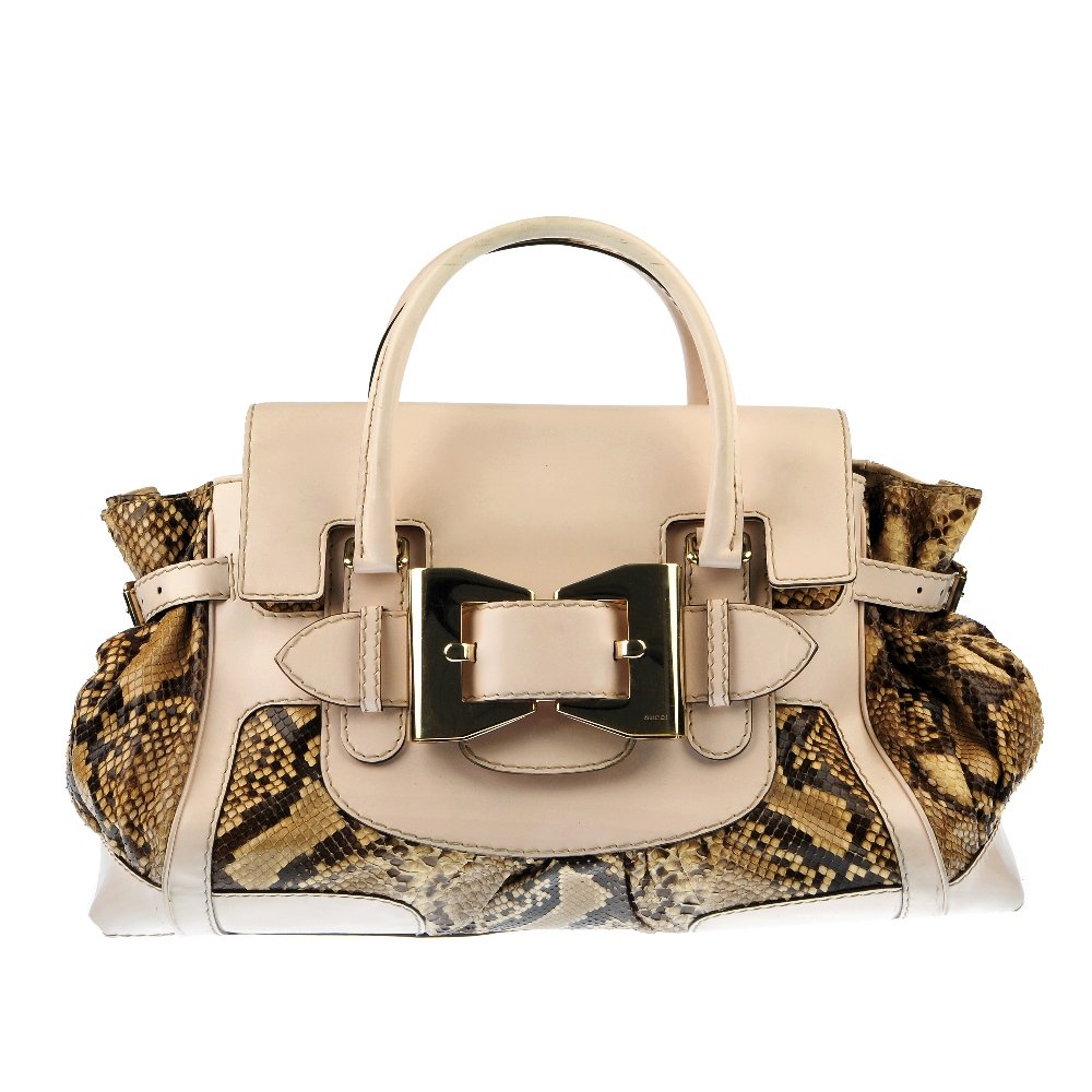 GUCCI - a cream and python skin bag.: GUCCI - a cream and python skin handbag. Designed with top flap and magnetic snap button fastening, silver-tone hardware to include large, front buckle feature, two top handles and three interior pock