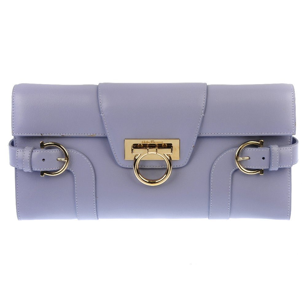 SALVATORE FERRAGAMO - two handbags.: SALVATORE FERRAGAMO - two handbags. To include a lilac leather clutch bag with silver-tone hardware and a red satin evening bag with detachable chain strap and latch fastening. Lengths 29 and 32cm. Bo