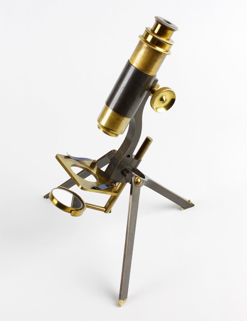 A late 19th century C. Baker of London cased folding: A late 19th century C. Baker of London cased folding monocular microscope, having rack and pinion coarse focusing, lacquered brass stage and plano/convex mirror, raised upon folding tripod base, 10.25