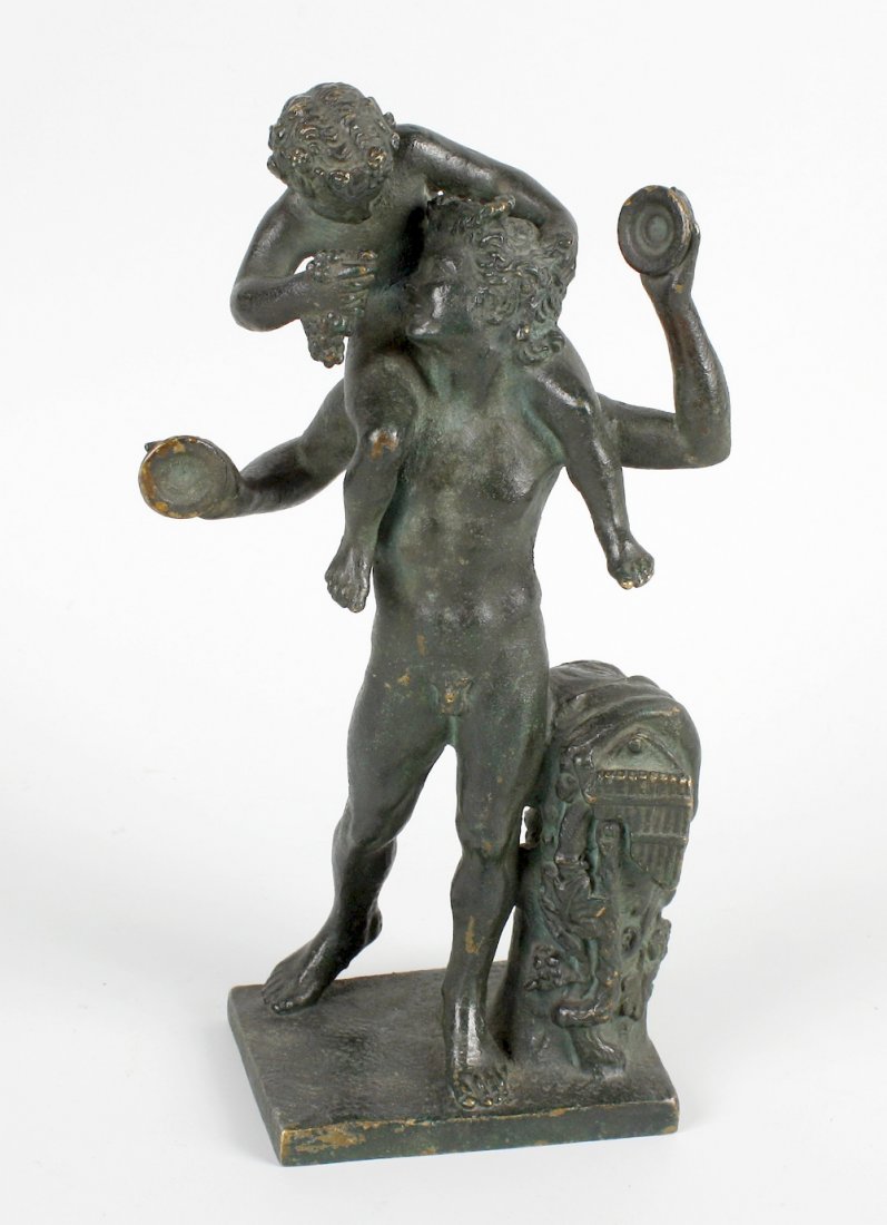 A 19th century 'Grand Tour' souvenir bronze figure: A 19th century 'Grand Tour' souvenir bronze figure group, Pan and Bacchus, after Claude Michel (Clodion), Bacchus seated upon Pan's shoulder holding a bunch of grapes, Pan holding cymbals, pan pipes t