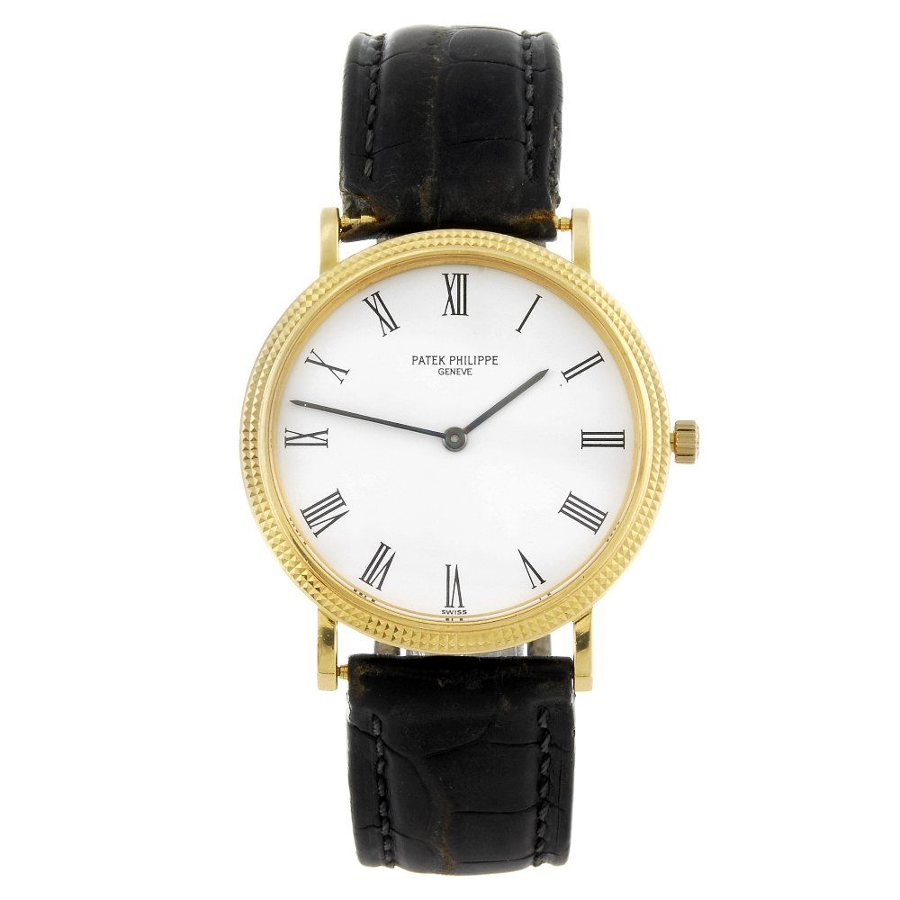 PATEK PHILIPPE - a gentleman's 18ct yellow gold: PATEK PHILIPPE - a gentleman's Calatrava wrist watch. Reference 3954, serial 2919300. Signed quartz calibre E23. White dial with Roman numeral hour markers. Hobnail bezel, 18ct yellow gold case fitted