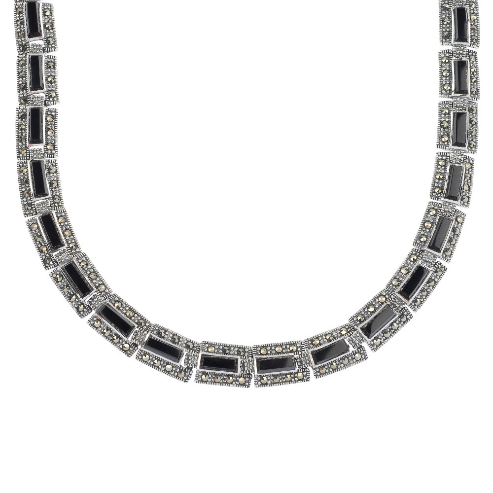A silver marcasite and onyx necklace.: A silver marcasite and onyx necklace. Designed as a series of rectangular-shape onyx links, to the marcasite sides. Hallmarks for London, 2012. Length 40cms. Weight 39.1gms.