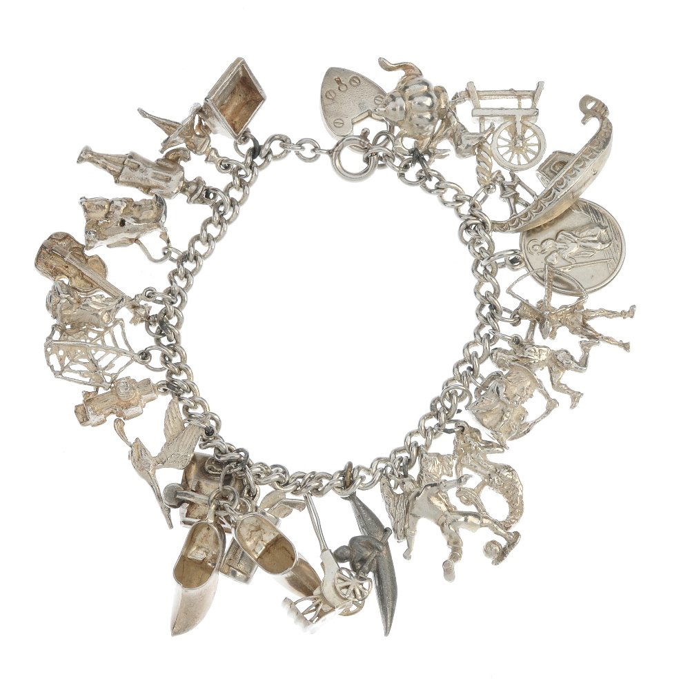 Two silver and white metal charm bracelets.: Two silver and white metal charm bracelets. The double curb-link chain and curb-link chain bracelets, suspending a total of thirty-three charms to include a rose, a rickshaw and a bunch of keys. One b