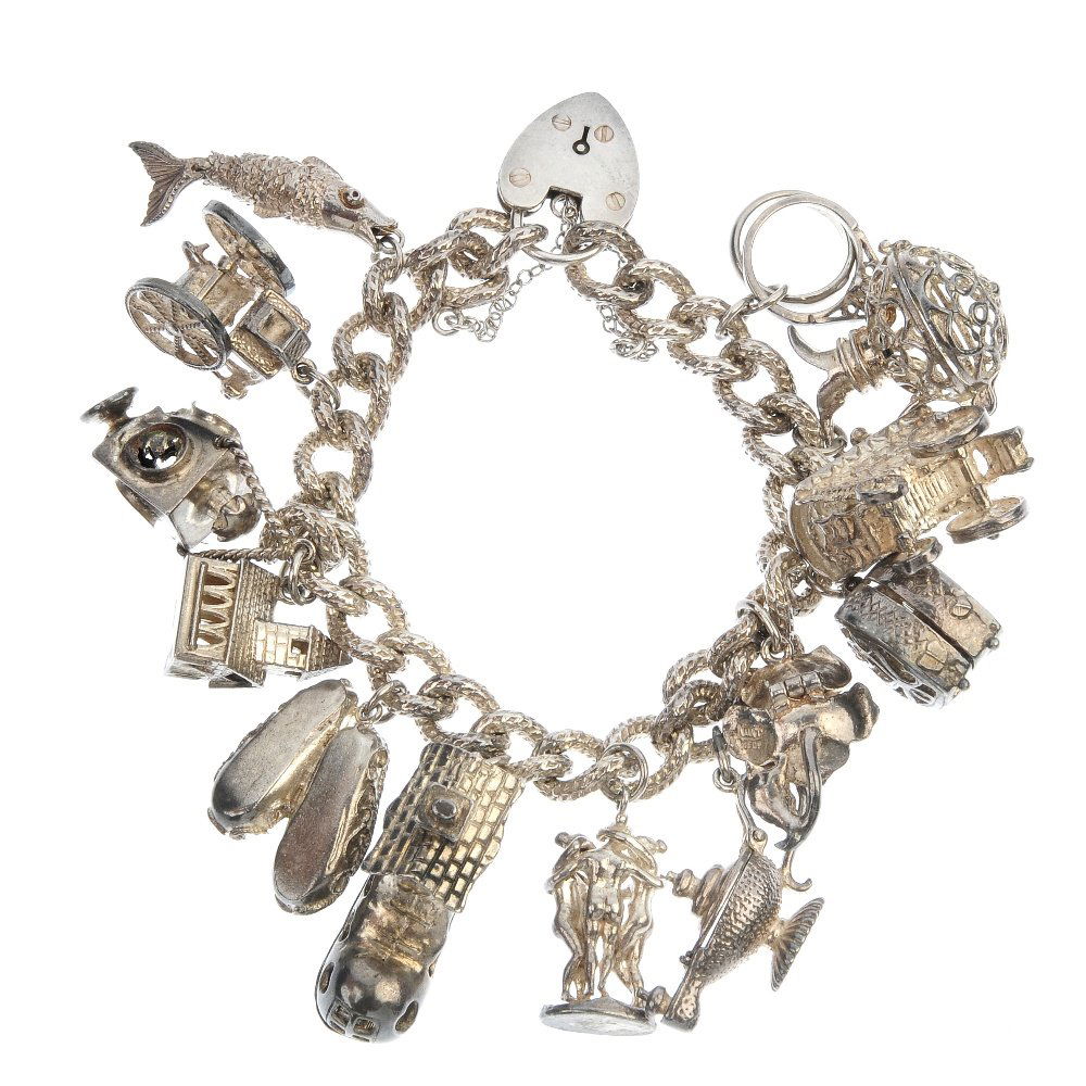 Four charm bracelets and three loose charms.: Four charm bracelets. The curb and belcher-link bracelets suspending a total of forty-one charms, to include a rocket, Big Ben and ballet slippers. Three charms loose. Most with marks to indicate silv