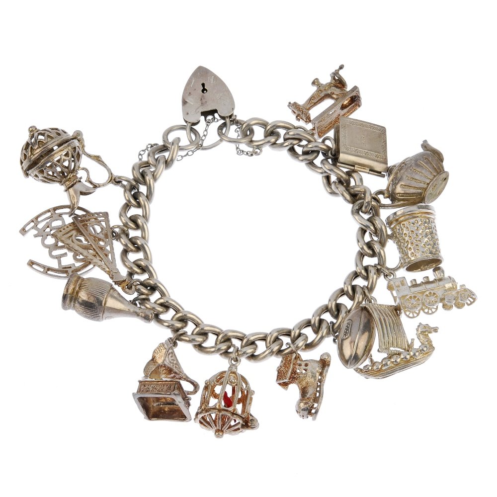 Four charm bracelets and six loose charms.: Five charm bracelets and six loose charms. To include three curb-link bracelets to heart-padlock clasps and a further fancy floral-link bracelet to a push-piece clasp suspending a total of fifty-five