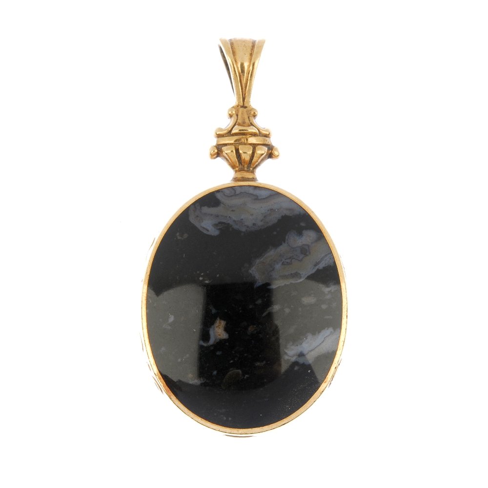 A 9ct gold agate double-sided pendant.: A 9ct gold agate double-sided pendant. The oval-shape red and black banded agate panels, to the scroll surmount. Sponsor's marks for David Scott Walker. Hallmarks for Sheffield, 1997. Length 5.8cms. W