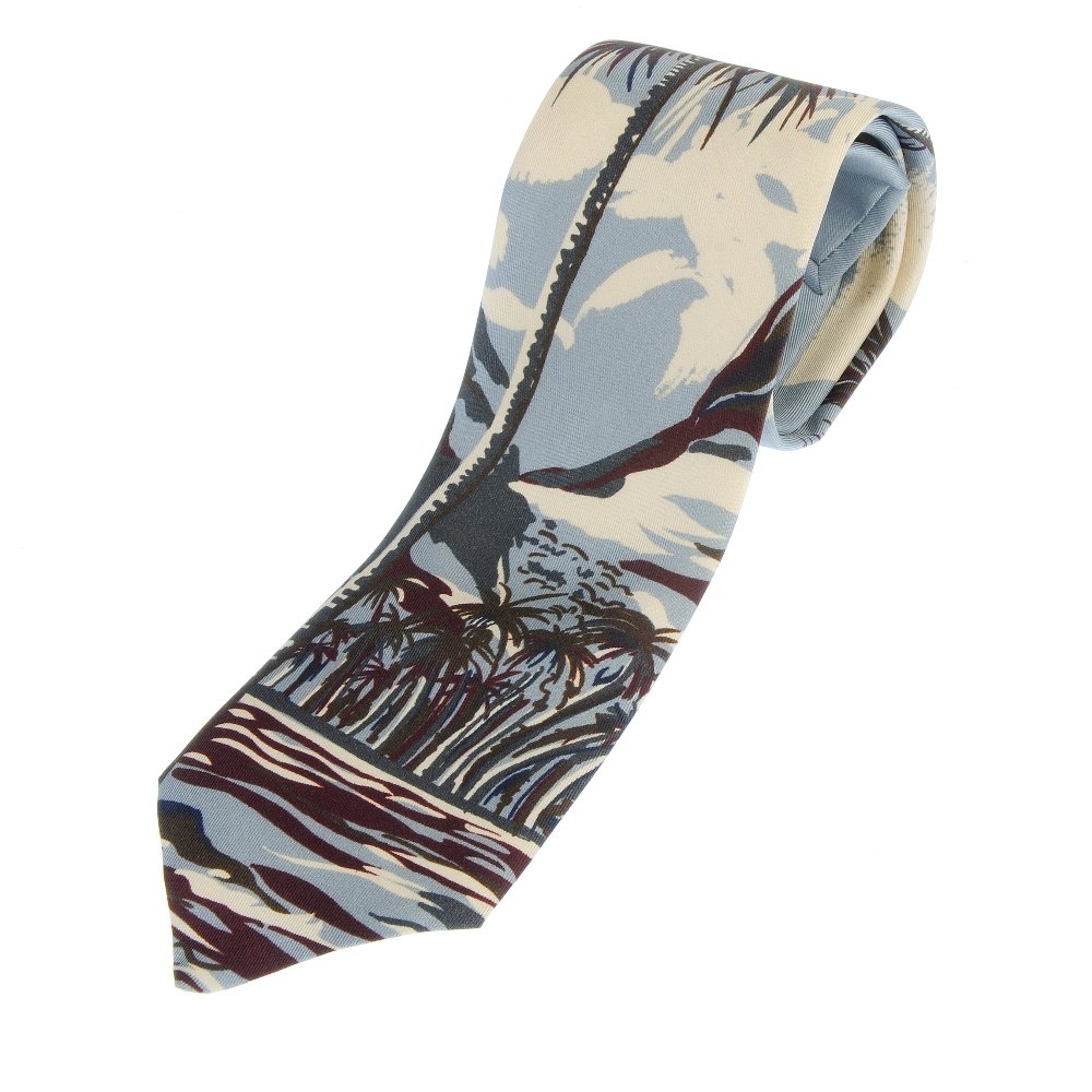 PRADA - a silk tie.: PRADA - a silk tie. Featuring a pale blue and dark burgundy and brown palm tree scene. Measuring 8 by 150cms. With maker's box.
