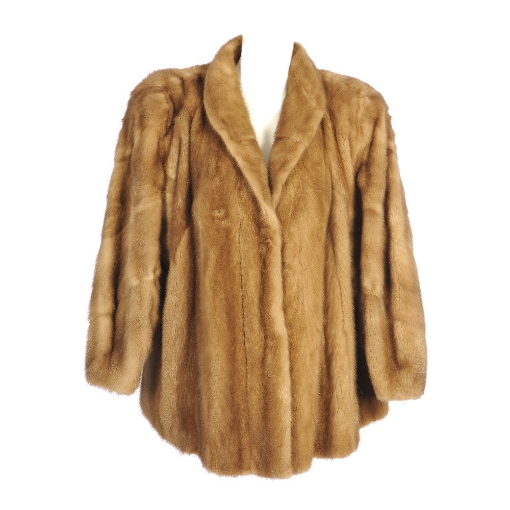 A pastel mink jacket: A pastel mink jacket. Designed with a short lapel collar, wide dolman sleeves tapered at the wrists, hook and eye fastenings, shoulder pads and two outer pockets. Labelled James Smith. Believed to be