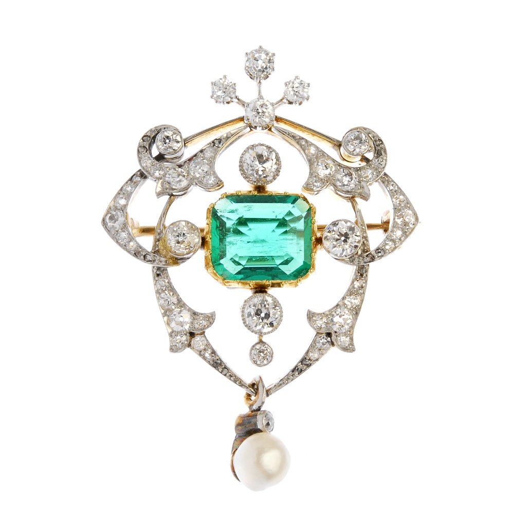 An Edwardian platinum and 18ct gold emerald diamond and: An Edwardian platinum and 18ct gold emerald diamond and natural pearl brooch. The rectangular-shape emerald, measuring 10.6 by 9 by 3.5mms, within an old-cut diamond quatrefoil and scrolling panel, su