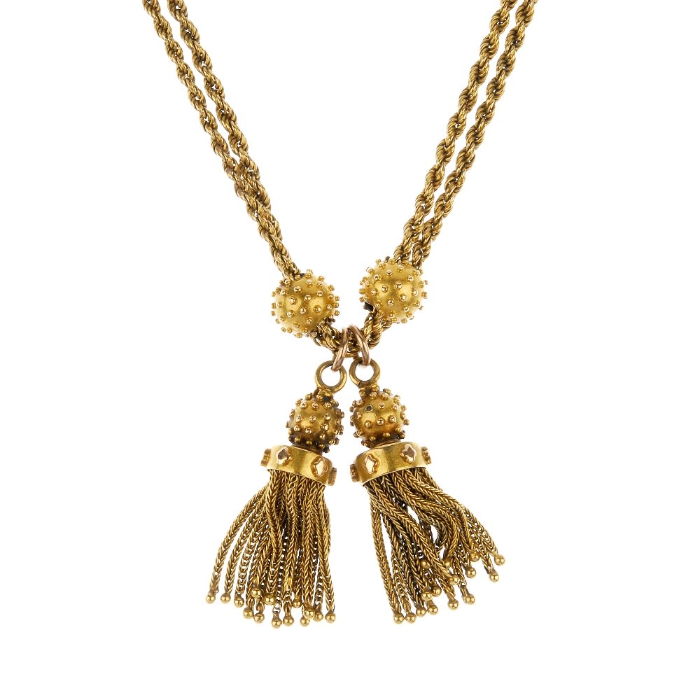 An early 20th century gold necklace.: An early 20th century gold necklace. Designed as two rope-link chains, with textured sphere sliders and similarly-designed tassel drops, to the single rope-link chain. Clasp deficient. Length 38cms. W