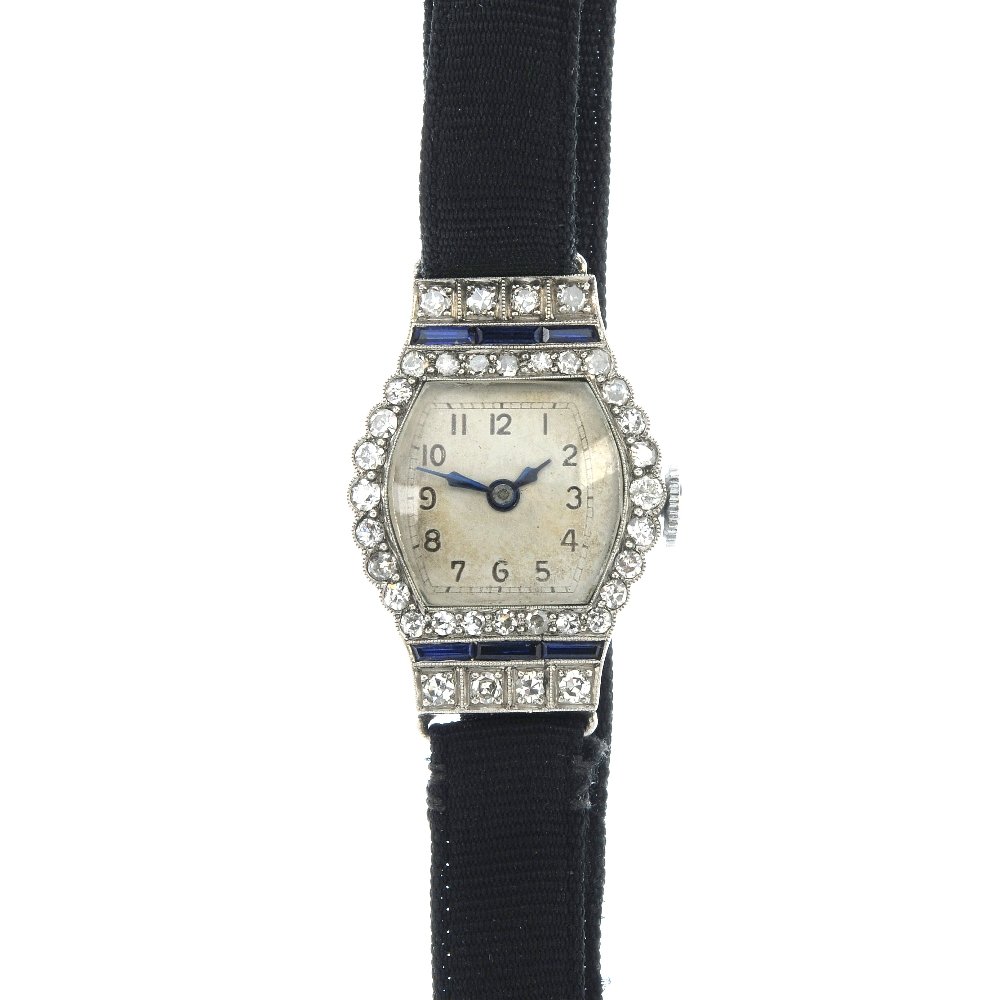 A lady's early 20th century platinum diamond and: A lady's early 20th century platinum diamond and sapphire manual wind cocktail watch. The silvered Arabic numeral dial, within an old and single-cut diamond case, with rectangular-shape sapphire highl