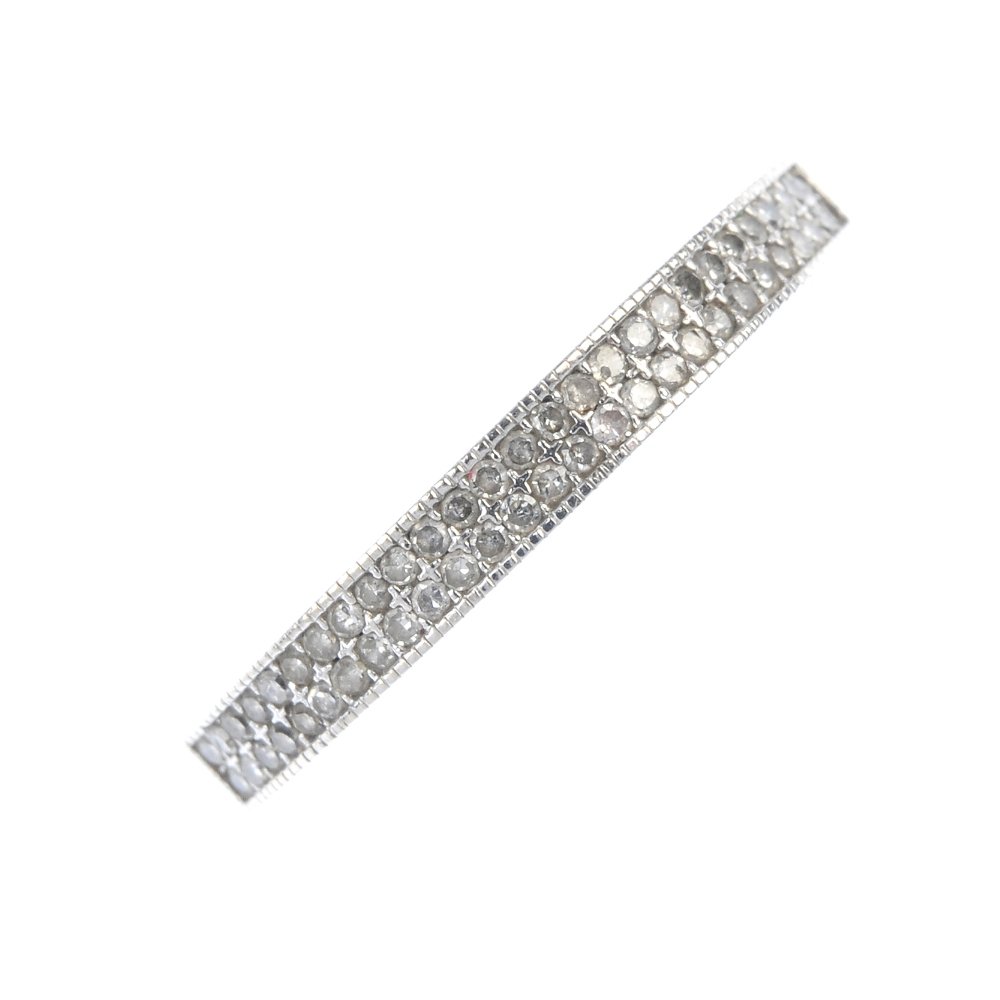 An 18ct gold diamond half-circle eternity ring.: An 18ct gold diamond half-circle eternity ring. Designed as two single-cut diamond lines, inset to the tapered half-band. Total diamond weight 0.18ct, stamped to band. Hallmarks for London. Weight 1.9
