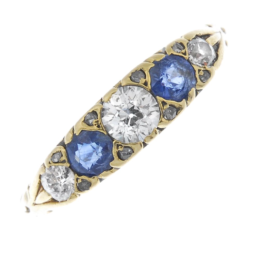 A diamond and sapphire five-stone ring. (1 of 2)