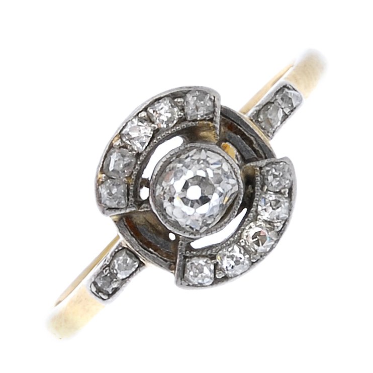 An early 20th century 18ct gold diamond cluster ring. (1 of 2)