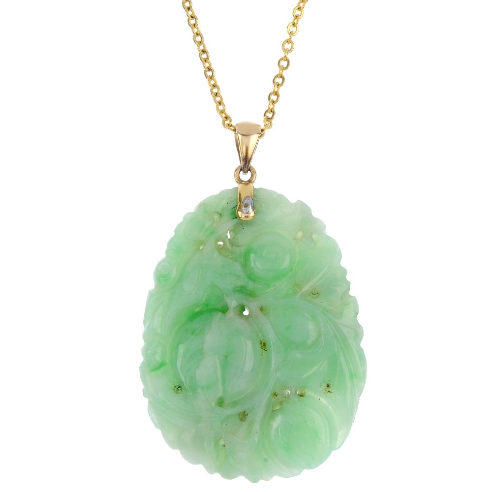 An early 20th century carved jade pendant. (1 of 2)