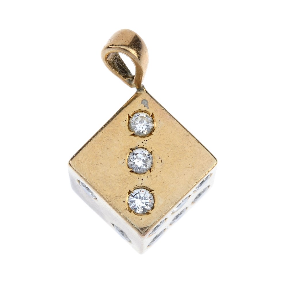 A 9ct gold diamond dice pendant. (1 of 3)