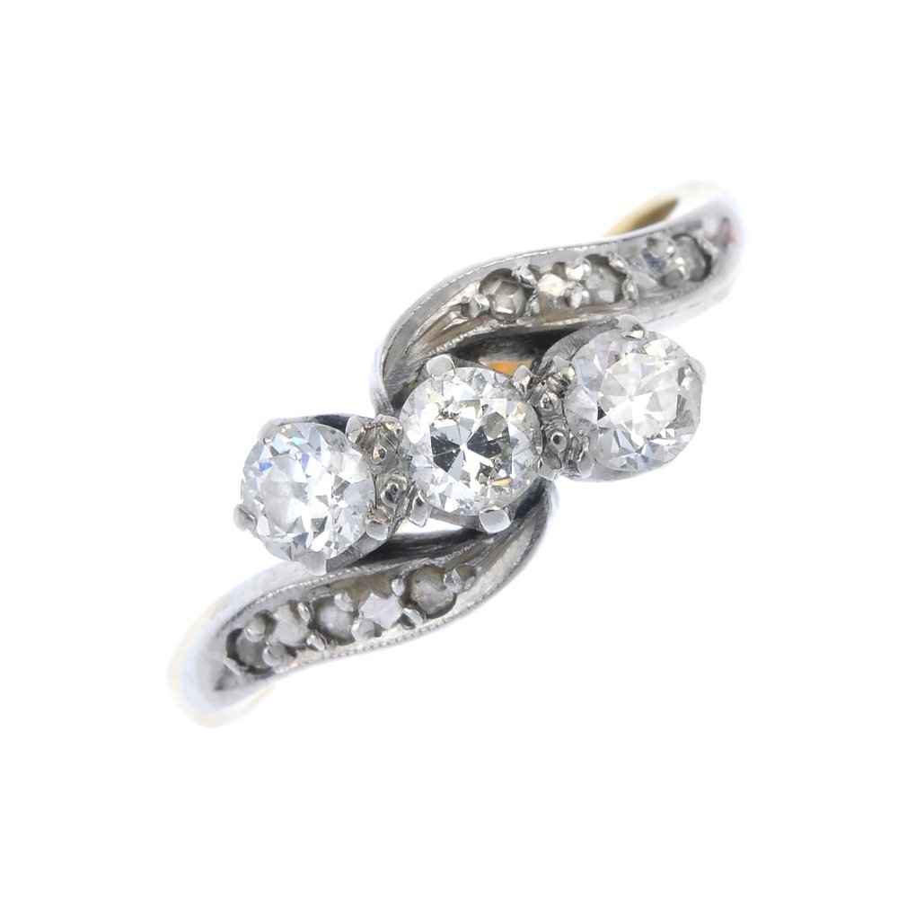 A mid 20th century 18ct gold diamond three-stone ring. (1 of 4)
