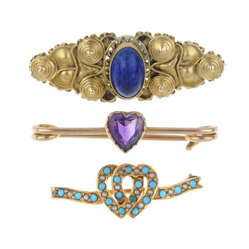 A group of four gem-set brooches. (1 of 2)