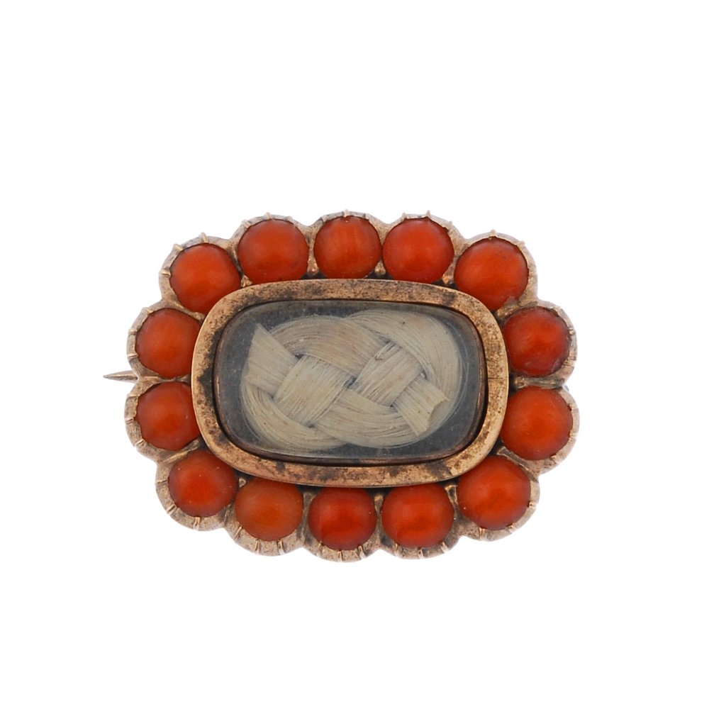 A mid Victorian coral and hair brooch. (1 of 2)