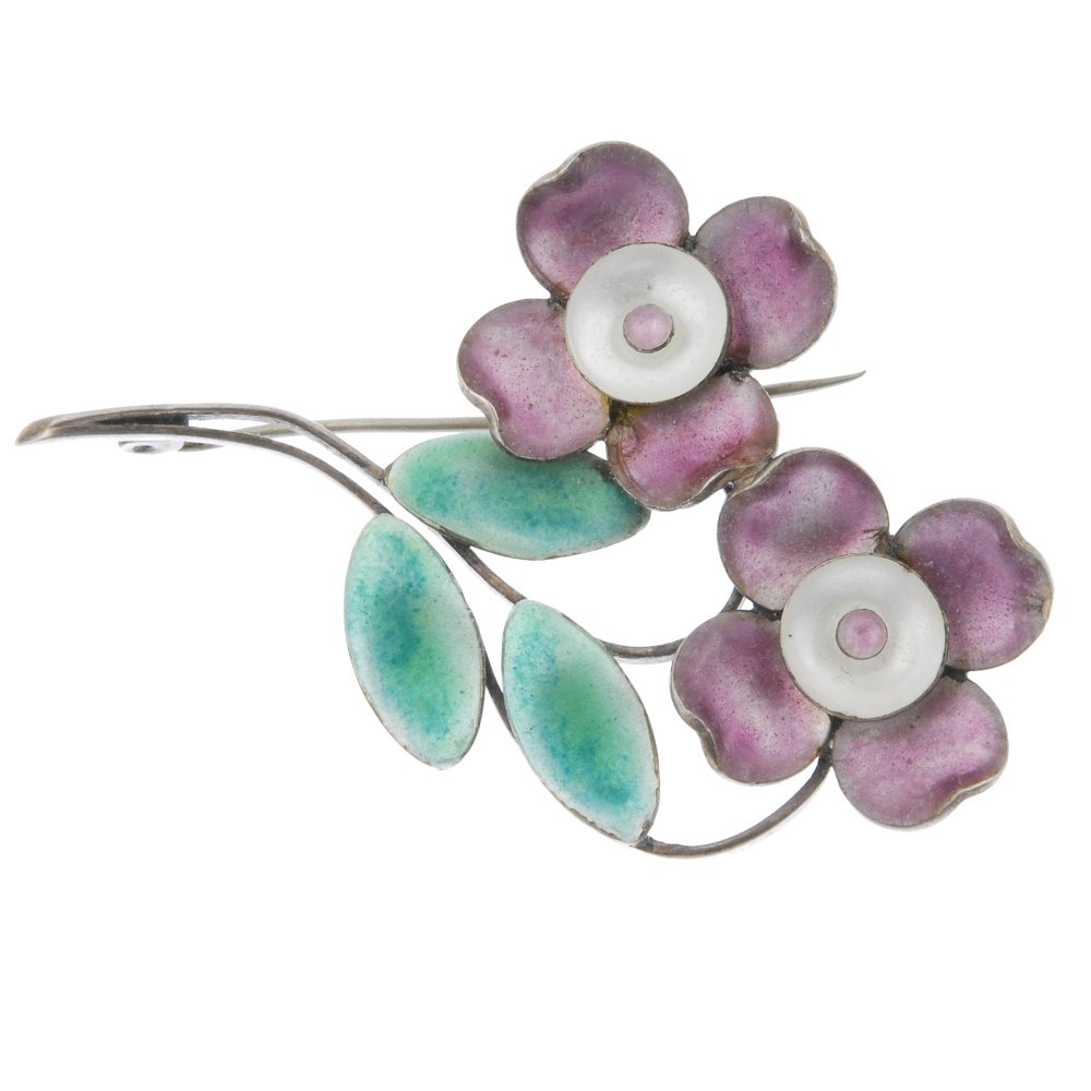 Three early 20th century brooches.: Three early 20th century brooches. To include a Kensington Art ceramic brooch designed as a plain blue-green ceramic oval, together with a Bernard Instone brooch designed as two purple and white ename