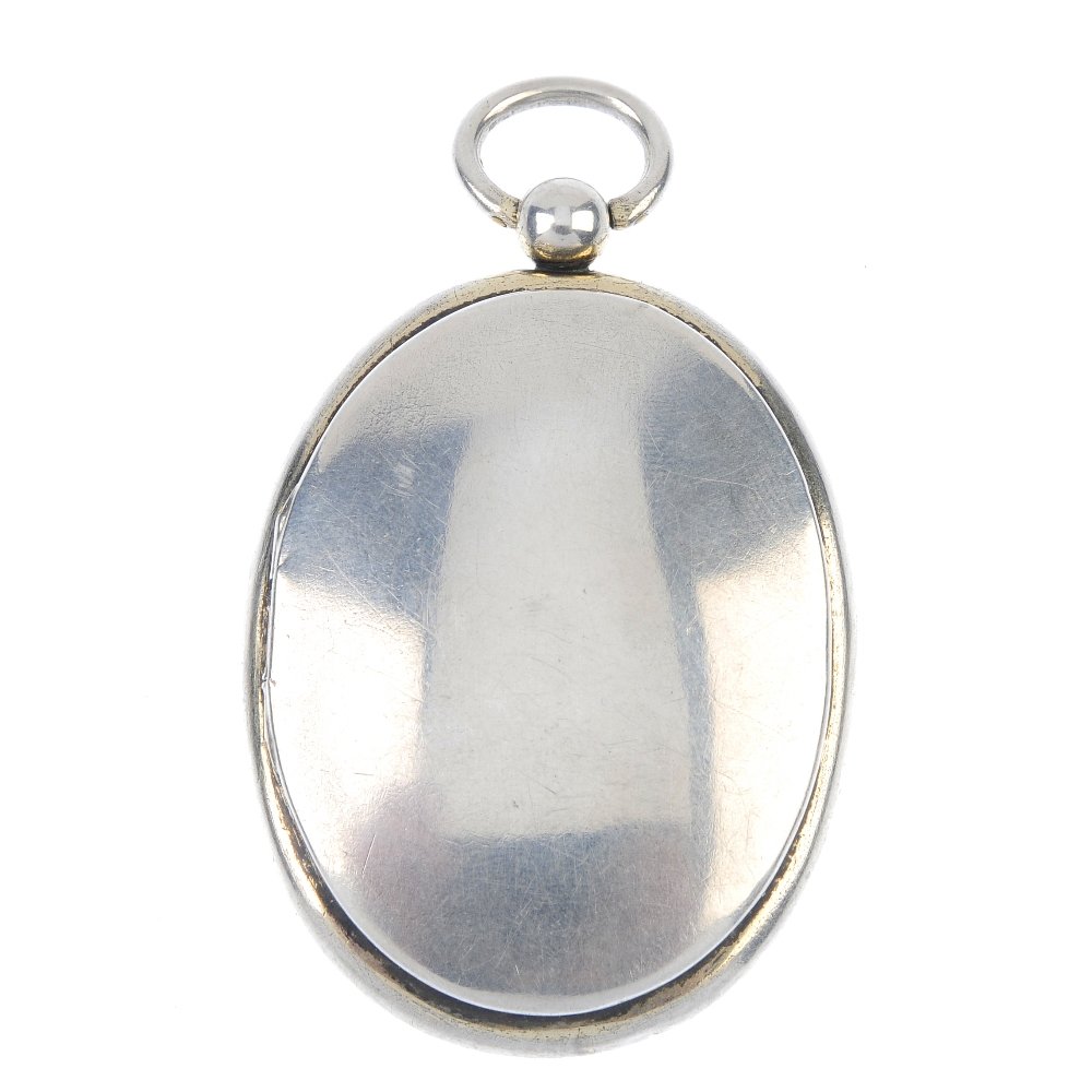 A mid Victorian silver double-sided locket, with (1 of 3)