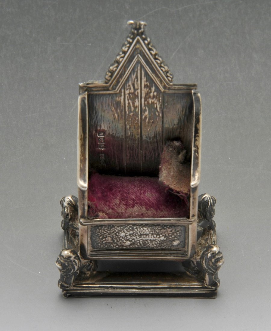 An Edwardian silver mounted pin cushion modelled as a (1 of 4)