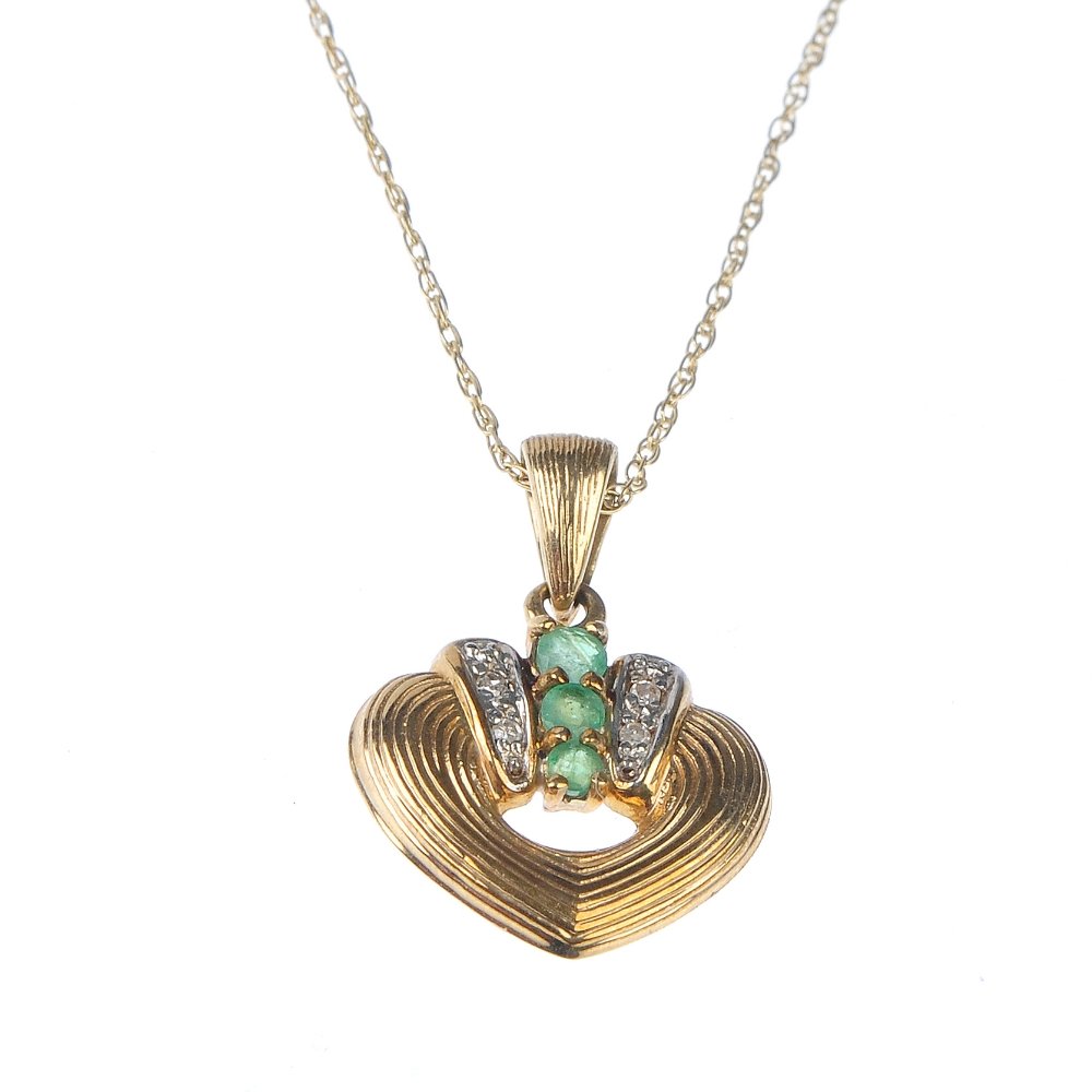 A 9ct gold emerald and diamond pendant. (1 of 1)
