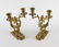 A pair of Victorian gilt brass two-branch candlesticks.