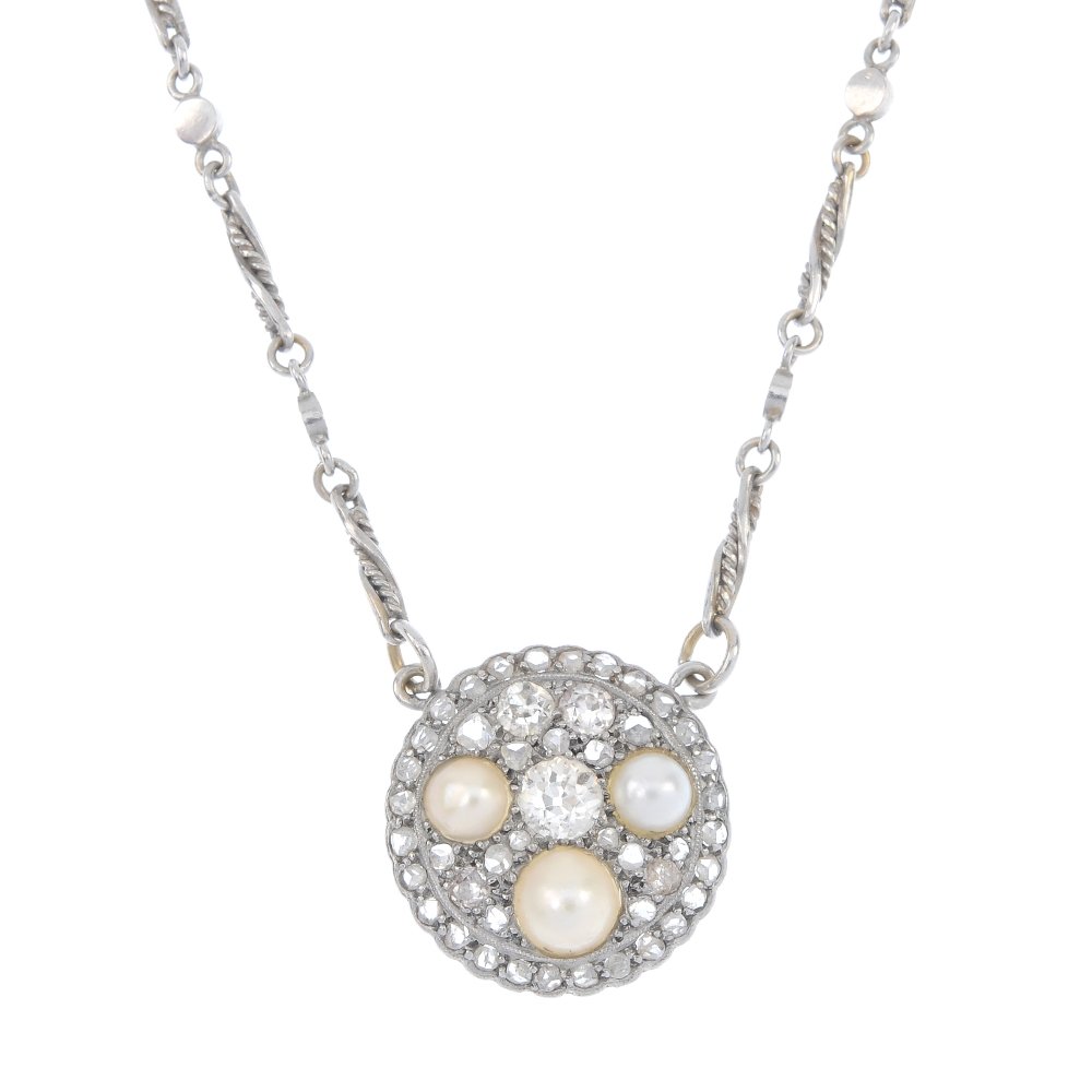 A diamond and split pearl pendant. (1 of 3)