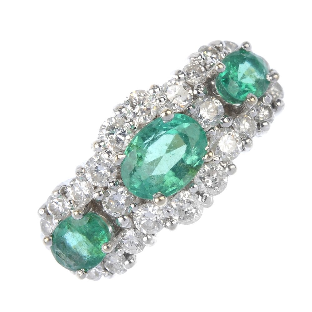 An emerald and diamond triple cluster ring. (1 of 4)