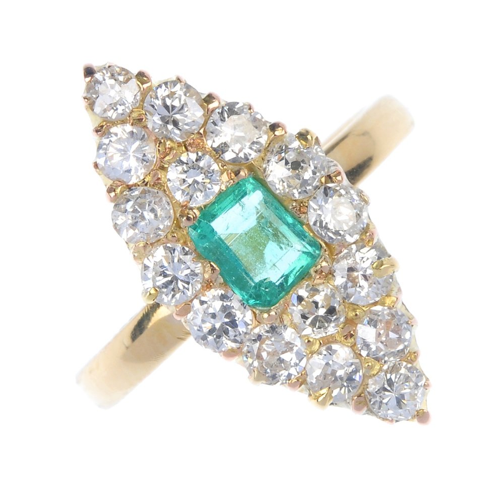 An emerald and diamond cluster ring. (1 of 4)