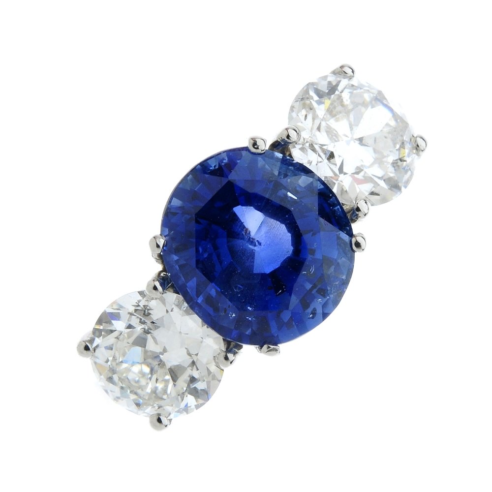 A Burmese sapphire and diamond three-stone ring. (1 of 5)