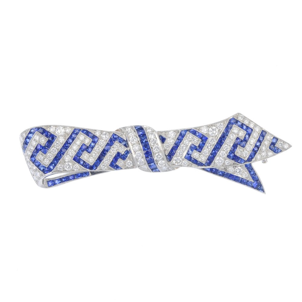 A sapphire and diamond bow brooch. (1 of 2)